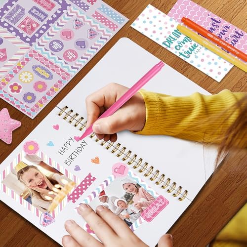 Close up of heart shaped stamp and decorative charm included in stationery kit