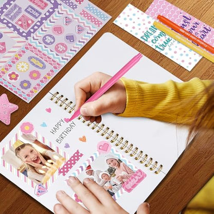 Close up of heart shaped stamp and decorative charm included in stationery kit