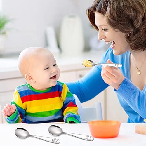 Toddler holding Pimoys stainless steel spoon during mealtime