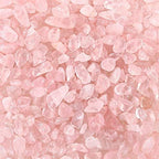 Pink quartz crystal chips arranged for reiki and crystal grids