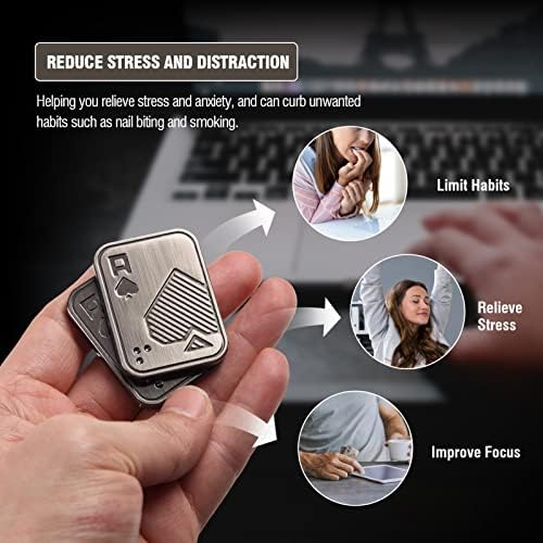 Wropzo silver push card mechanical clicker toy sitting next to a pocket notebook on an office desk