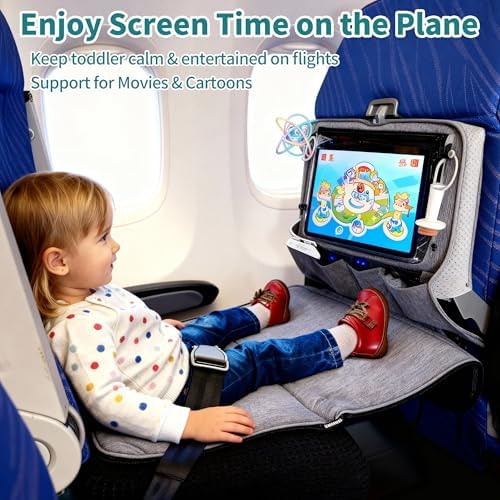 NNOODUST baby travel bed showing the integrated tray table cover with raised edges and clear tablet pocket.