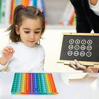 Large size rainbow push pop bubble learning board held by an elementary school teacher