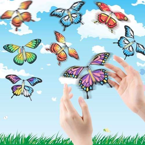 Placing a wound-up butterfly craft inside a colorful greeting card for a birthday surprise
