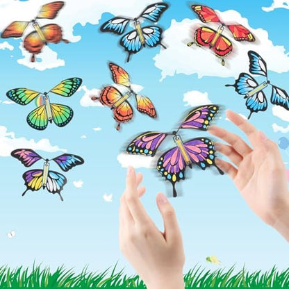 Placing a wound-up butterfly craft inside a colorful greeting card for a birthday surprise