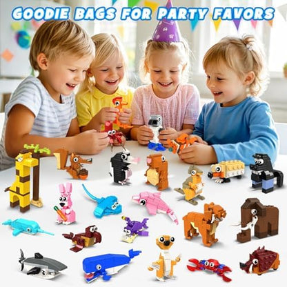Children sharing separate packs of Hogokids mini wildlife building toys as return gifts