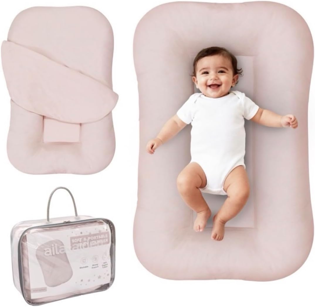Aila + Aiden baby lounger front view pink snuggle collection organic cotton infant floor nest