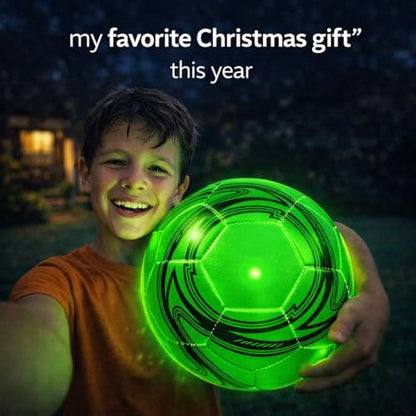 Youth player kicking the extra bright glowing soccer ball during an evening backyard game