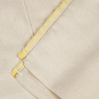 OsoCozy unbleached prefold cloth diapers in natural lighting emphasizing the chemical-free ivory cotton fabric.