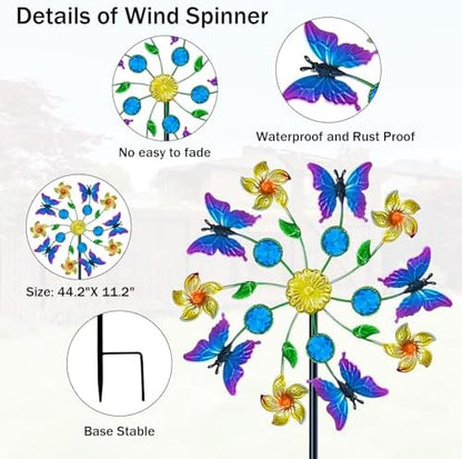 Close up of colorful metal butterfly design on garden windmill
