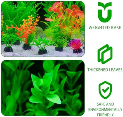 Assorted sizes of realistic green and red artificial aquatic plants arranged inside a clean aquarium.
