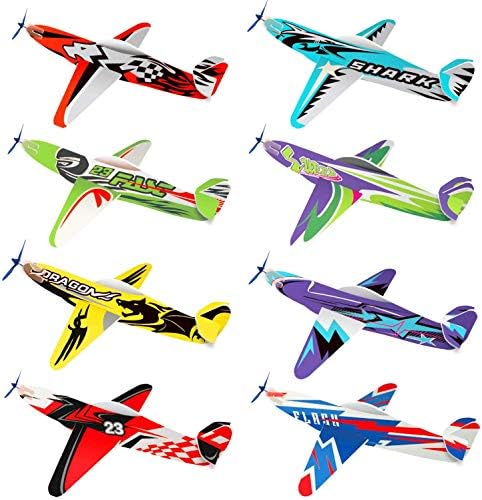 A child easily assembling a Joygogo lightweight foam flying glider plane outdoors without using any tools.