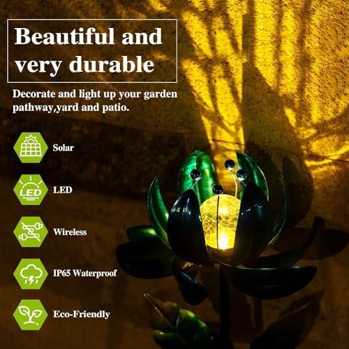 Nighttime view of illuminated solar lotus garden stake