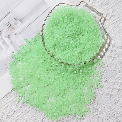 Package of colourful resin luminous stones for decor