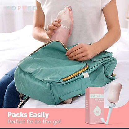 Pink Popped Peri Bottle being held to demonstrate soft squeeze material