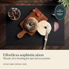 Servietto disposable paper table settings protecting a clean wooden surfaces.