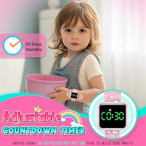 Toddler wearing pink unicorn potty training watch on wrist
