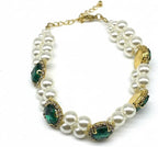 Hotlion adjustable pearl dog collar with rhinestone setting worn by a small white puppy.