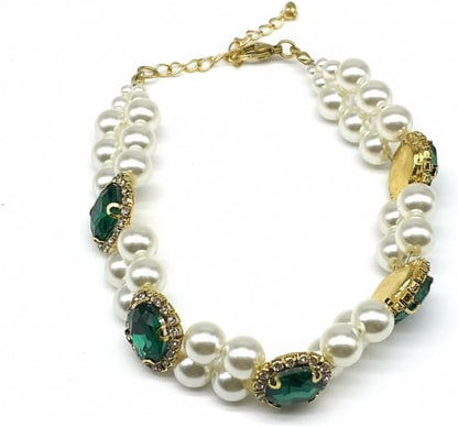 Hotlion adjustable pearl dog collar with rhinestone setting worn by a small white puppy.