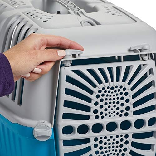 MidWest Homes for Pets travel carrier being lifted by its integrated carrying handle