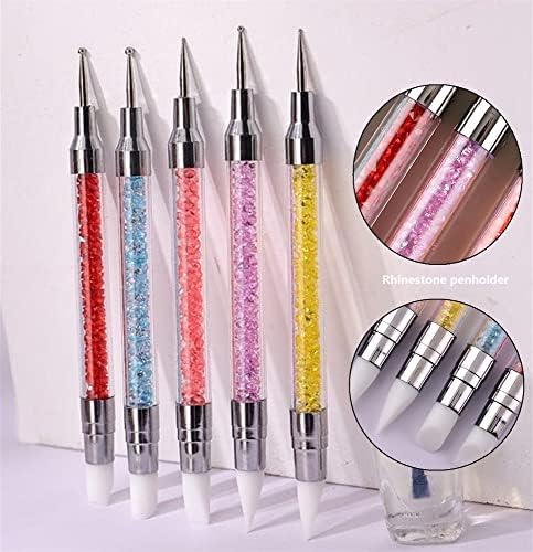 Manicure drawing tools being used to create intricate dots on a nail surface