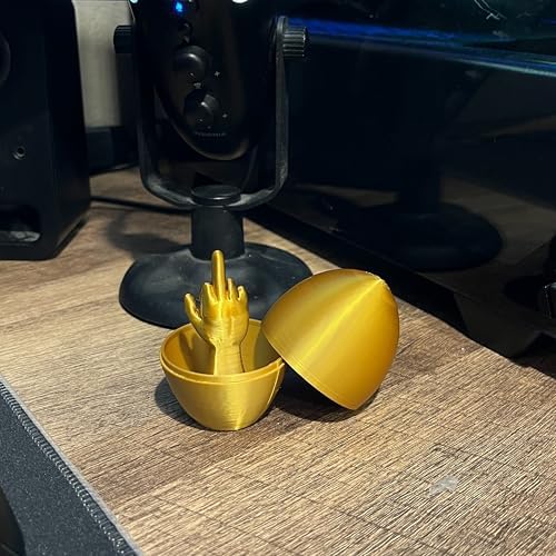 Sarcastic humor office prank gift gold egg next to holiday decorations