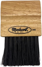 Markwort umpire brush front view showing wood handle and black bristles
