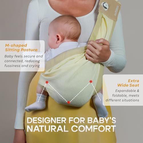 A mother comfortably nursing her newborn baby using the hands-free BabieBoo sling carrier setup.
