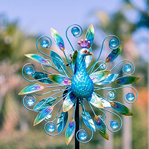 Close up of vibrant peacock metal feathers on kinetic wind sculpture