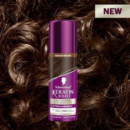 Person applying temporary root spray to gray hair roots