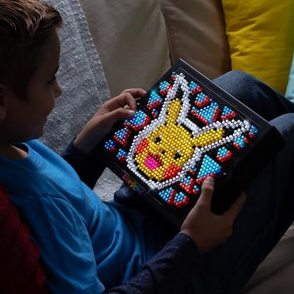 Lite Brite HD Pokemon Edition glowing in a dark room