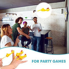 Group of colorful novelty flying chickens bouncing off an indoor surface during a backyard game