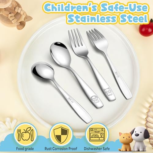 Child holding Lianyu toddler utensil set during mealtime