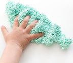 Child using non toxic bead textured modeling foam to sculpt shapes and develop fine motor skills.