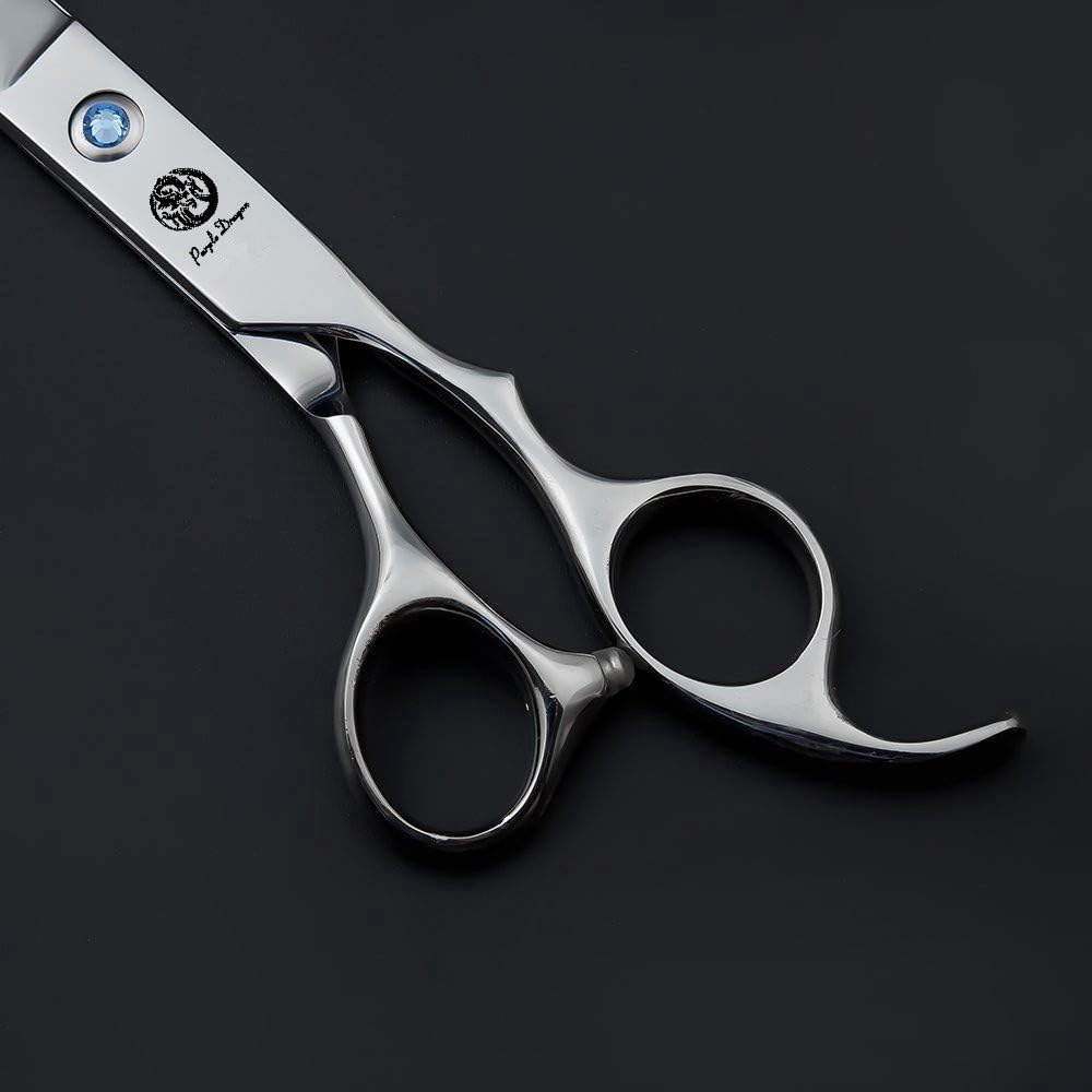 Detailed shot of the engraved dragon logo on the Purple Dragon grooming scissors blade