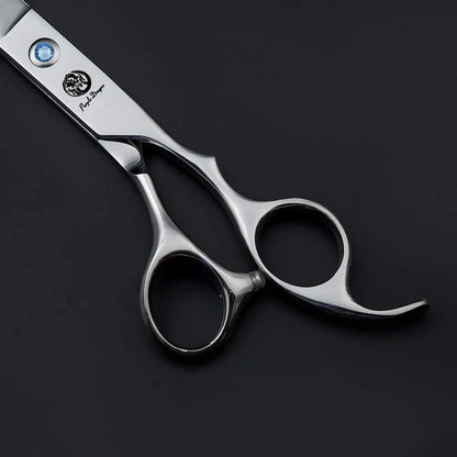 Detailed shot of the engraved dragon logo on the Purple Dragon grooming scissors blade