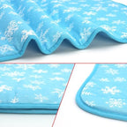 Small size NACOCO pet cooling mattress pad laid out flat on a living room floor for cats.