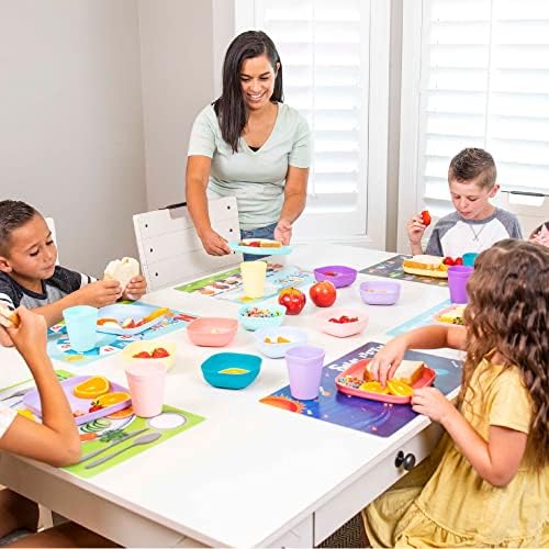 Hapinest reusable plastic placemats being wiped clean with a damp cloth on a dining table.