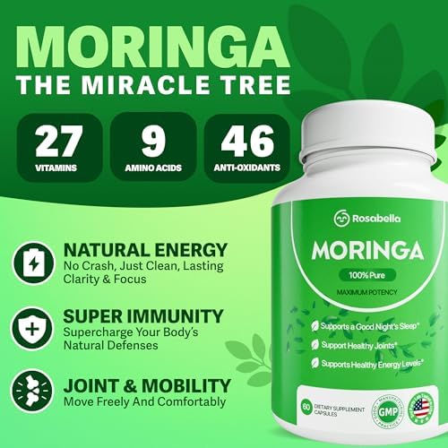 Close up of Rosabella Moringa supplement capsules with green leaves