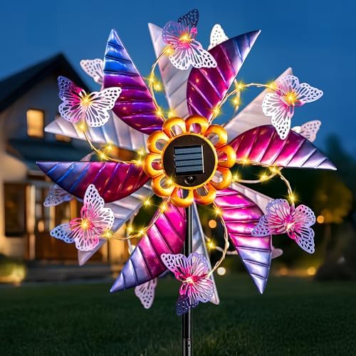Qualdout kinetic wind spinner illuminated by solar LED lights at night