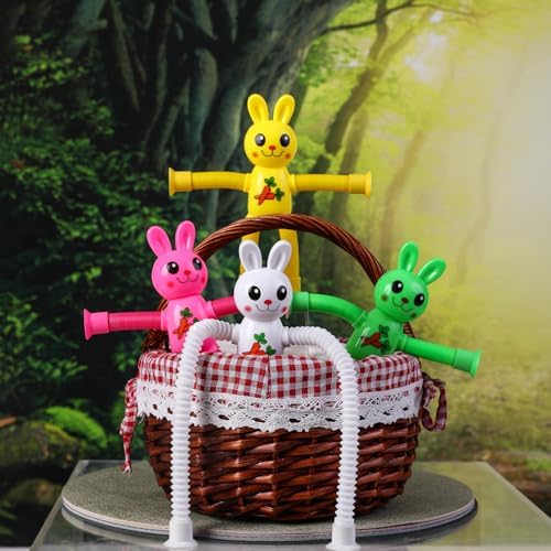 Four vibrant sensory pop tube bunny toys stretched out into different shapes on a table.