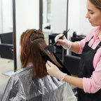 Demonstration of hair placement on balayage board for even color