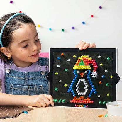 Side angle view of the Lite Brite drawing board showcasing its sleek portable design and battery compartment setup.