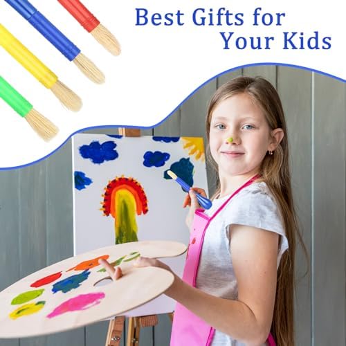 Four colorful toddler tempera paint brushes laid out on a white surface