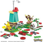 Pidgey and Wooloo figures positioned near the rotating blades of the countryside windmill set.