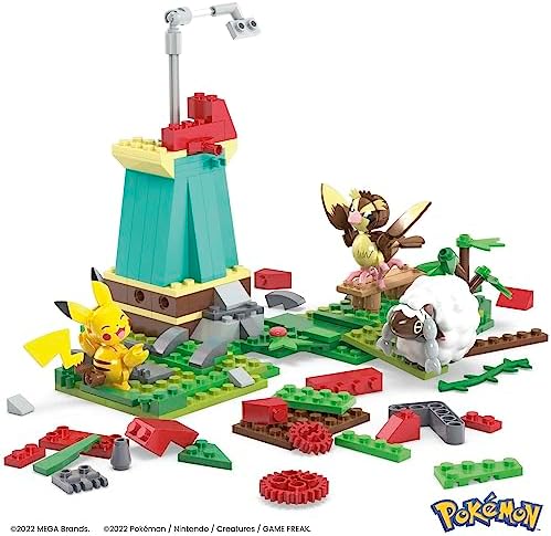 Pidgey and Wooloo figures positioned near the rotating blades of the countryside windmill set.
