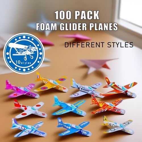 A massive collection of one hundred unboxed multi-colored mini paper airplane style foam gliders.