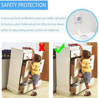 YEYA child safety straps installed behind a wooden chest of drawers securing it firmly against a painted wall.