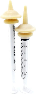 Close up of the flexible latex mini and original miracle nipples alongside medical grade syringes.
