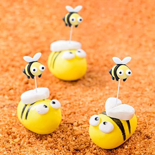 Close up of decorative bumble bee cupcake toppers